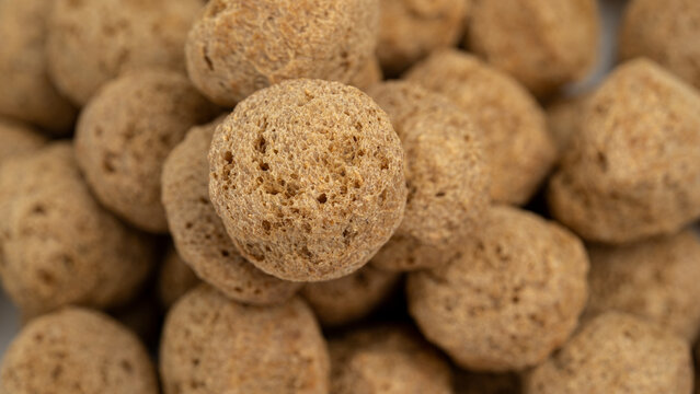 Macro of soya chunks showing porous meat substitute texture