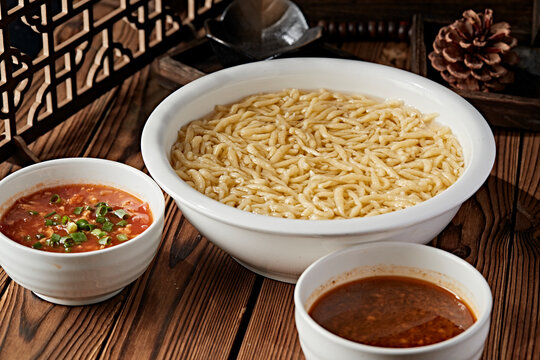 Thick pea flour soup served in a white porcelain bowl
