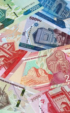 Uzbekistani som money bills in pile on table. Uzbekistan UZS currency cash close up
