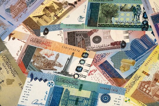 Sudanese pound money bills in pile on table. Sudan SDG currency cash close up