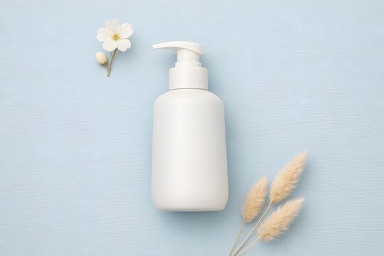 White pump bottle mockup flat lay with paper leaves on white background