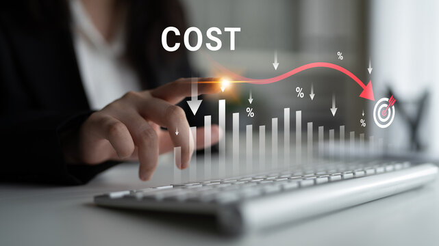 Business professional analyzing cost trends with keyboard and graphical data representation showing percentages and target icons in an office setting. Glyphic.