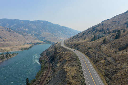 Scenic Highway Along Thompson River With Mountains and Wide River Valley in British Columbia Canada