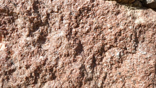 Natural Pink Granite Rock Texture Background, Rough Stone Surface Close Up, Abstract Mineral Pattern for Construction and Architectural Design