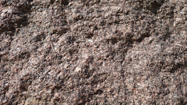 Rough Pink Granite Rock Texture Background, Natural Stone Surface Close Up with Mineral Pattern for Construction and Architectural Design