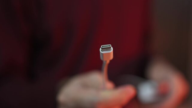 Close-up of type C wire for charging phone. Unbox type-C connector for charging phone
