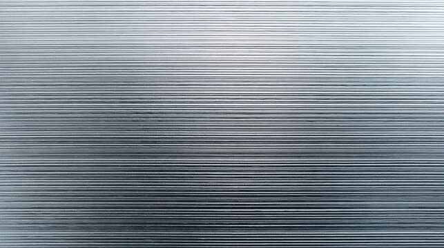 Macro view of a metallic lenticular textured surface with fine horizontal lines and gradient lighting