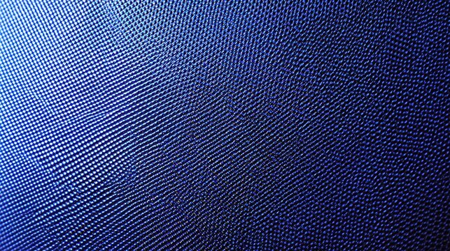 Close up view of a bright blue digital monitor screen displaying glowing pixels and grid patterns