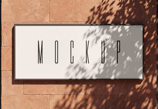 Wall Sign Mockup on Terracotta Stone Wall with Tree Shadow