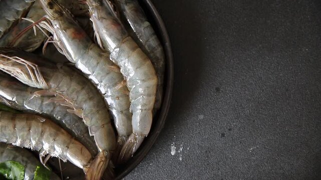 Raw prawns crustacean large shrimp (gambas) fresh seafood pescetarian diet food preparation tasty snack fresh and delicious gourmet food background on the table rustic food top view copy space keto an