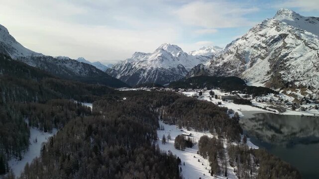 Aerial view of snow capped mountains in Engadin valley, 4K video footage