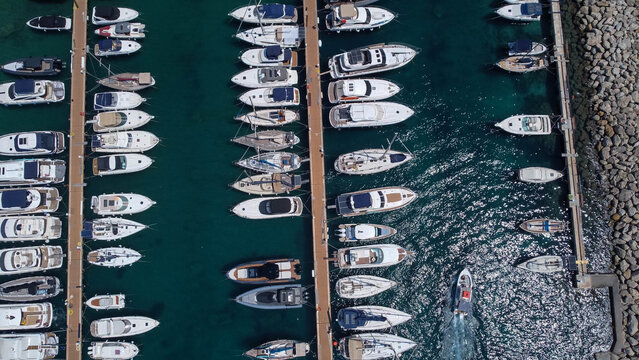 Drone view of boats mored in Mgarr harbour in Gozo Island, Malta.