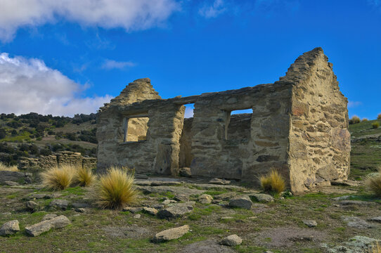 Ruin of a house with stone walls in the ghost town of Welshtown, Bendigo, in the harsh environment of Central Otago, South Island, New Zealand. In the 1870&rsquo;s, this was a rich gold mining community

