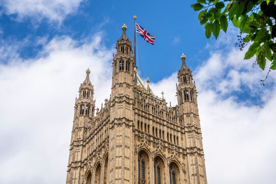 The Victoria Tower of the Palace of Westminster seen from College Garden. The 98.5-metre Gothic Revival tower was designed by Charles Barry, London, UK.