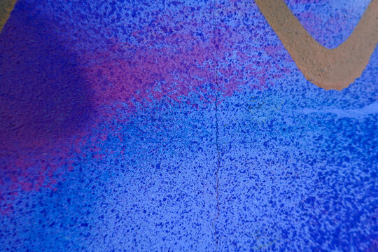 Vibrant urban graffiti wall with colorful spray paint texture and street art details