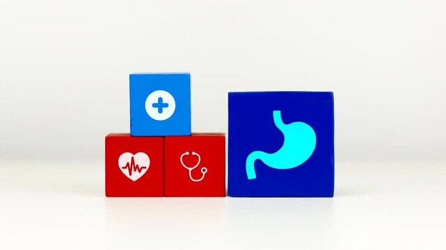 The doctor's hand displays a cube with a stomach icon. Raising awareness about gastric health and preventing gastritis and stomach ulcers.