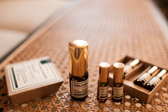 Tel Aviv, Israel 9 of July 2026 - Zielinski Rozen perfume set with mini size and fragrance bottle in 10ml on rattan table close up.