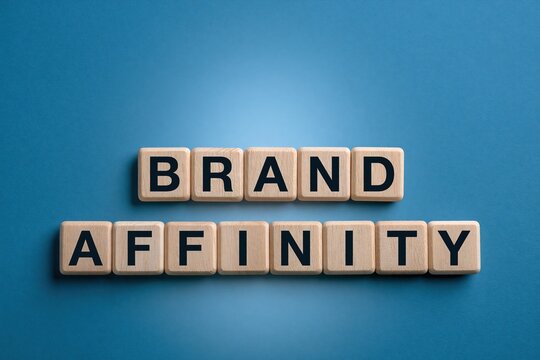 Brand affinity written on wooden tiles over blue background