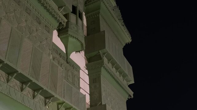 Editorial footage of the upper facade and traditional wooden rawasheen of Wali House (Bait Wali) in Al Balad Historic District, Jeddah, Saudi Arabia, captured at night in July 2026. A remarkable examp