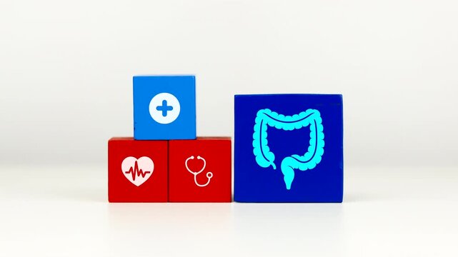 The doctor's hand displays a cube with the large intestine icon. This raises awareness about colon health and the prevention of colorectal cancer and chronic constipation.