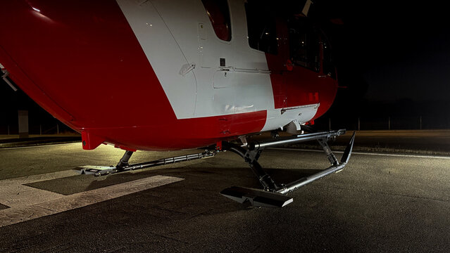 Professional Medical Air Ambulance Helicopter Parked on Hospital Helipad at Night for Emergency Response Marketing