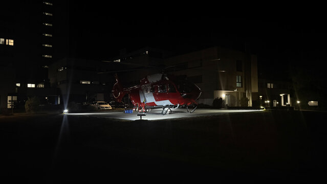Medical rescue helicopter on hospital helipad in city center for emergency medical services advertisement