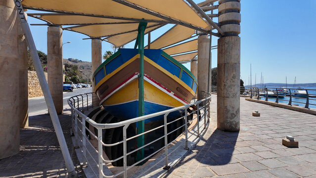 Mgarr, Gozo, Malta - 29.06.2026 - Traditional colorful Malteze boat Luzzu near Gozo ferry terminal.