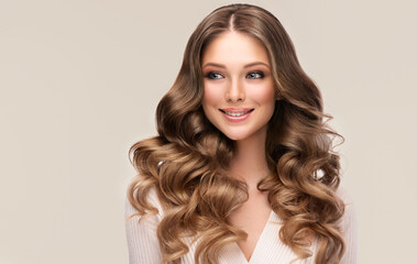 Beautiful laughing blonde model girl with long curly hair . Smiling woman hairstyle wavy curls ....