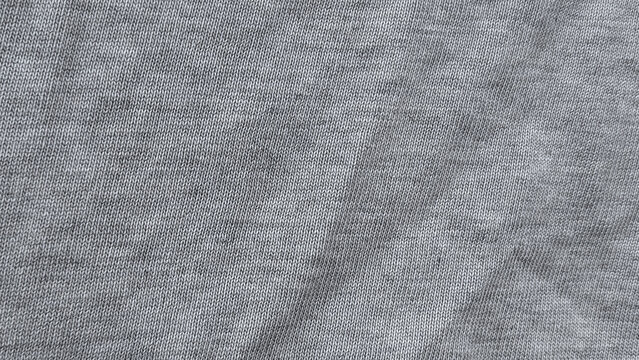 Grey fabric with a tight uniform woven texture and smooth surface