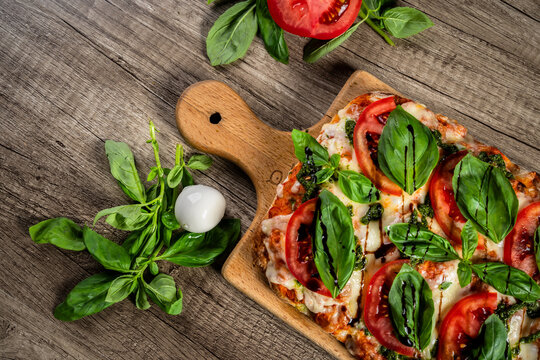 Fresh homemade pizza topped with melted cheese, tomato sauce, and flavorful ingredients, baked to a golden crust, showcasing delicious comfort food and traditional home cooking.