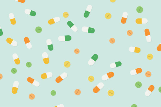Colorful vitamin capsules and tablets pattern on mint background
