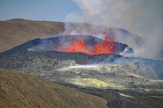 Lava fountains bubbling in a volcanic crater, Fagradalsfjall, Reykjanes, Grindavik, Iceland