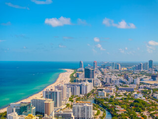 Fototapeta premium Aerial Panorama of Miami Beach, Florida Coastline with Luxury Hotels, Atlantic Ocean and Sunny Blue Sky