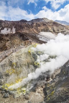 Smoking fumaroles with sulphur depositions on Mutnovsky volcano, Kamchatka, Russia