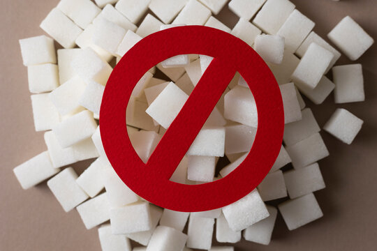 Sugar and prohibition sign on colored background top view. Diabetes concept, blood sugar level