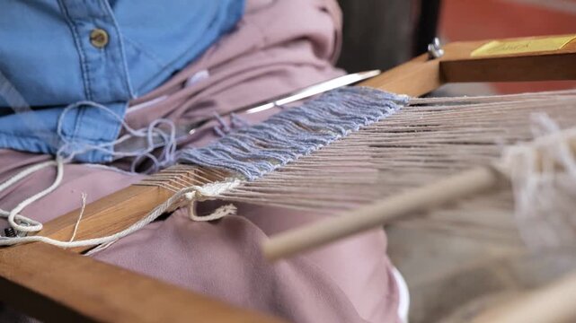Woman's hands knitting with yarn
