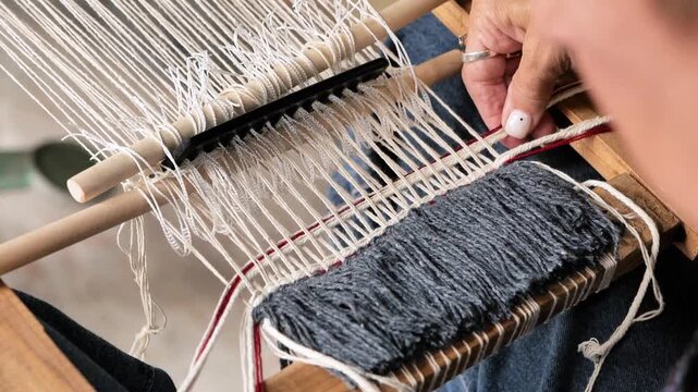 Woman's hands knitting with yarn