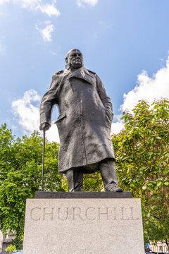 Bronze statue of Sir Winston Churchill by Ivor Roberts-Jones (unveiled 1973), in naval greatcoat, on a granite pedestal, north-east corner of Parliament Square, Westminster, London, UK.