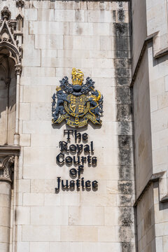 Detail of the Royal Coat of Arms carved on the facade of the Royal Courts of Justice, Strand, the supreme civil court of England and Wales, designed by George Edmund Street (1882), City of Westminster