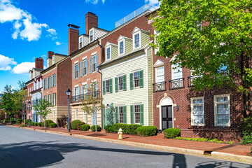 Obraz premium street with modern brick townhouses lining the road.