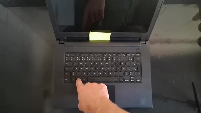 Finger pressing specific keyboard key on modern laptop video footage clip