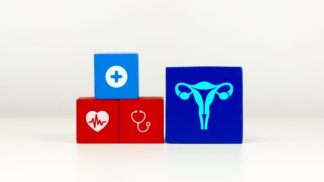 The doctor's hand displays a cube with a uterus icon. Raising awareness about gynecological diseases and preventing uterine pathologies.