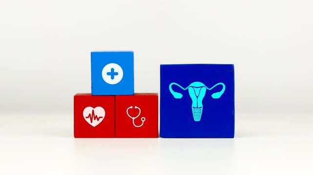 The doctor's hand displays a cube with a uterus icon. Raising awareness about gynecological diseases and preventing uterine pathologies.