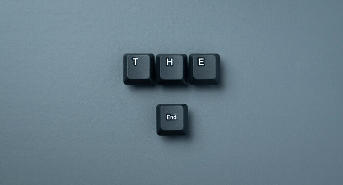The End Final Chapter Concept With Keyboard Keys On Gray Background