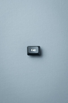 Escape Key Concept On Minimal Gray Background With Copy Space