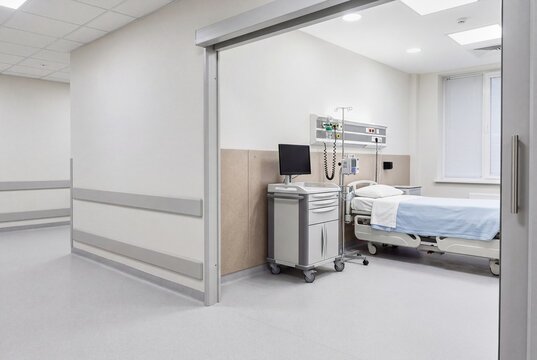 Clean hospital ward corridor with patient room entrances and clinical equipment - front view