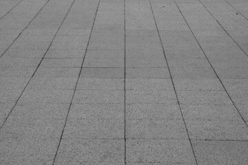 Obraz premium empty stone floor top in perspective. grey tile floor background in perspective view. line. empty copy space stone street. pavement. Granite outdoor tiled floor. gray granite. Marble texture