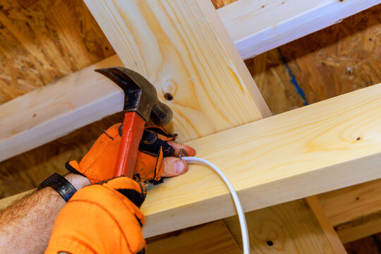 Building wooden frame with tools in construction site in residential area