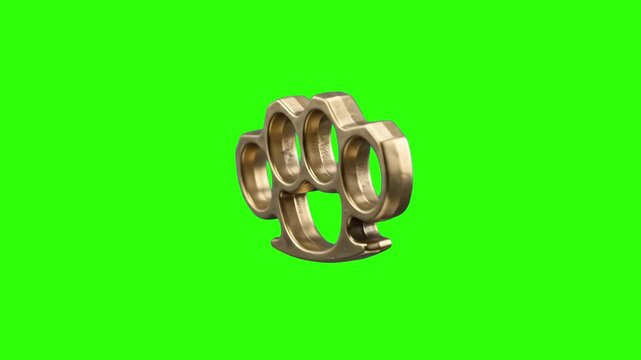 A classic gold metallic brass knuckles hand weapon rotating in a continuous turntable loop. Isolated against a solid chroma key green screen background for crime, action, and street fight video overla