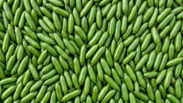 Background of fresh green raw snap peas close-up overhead view with vegetable ingredient vegetarian nutrition agriculture vitamins